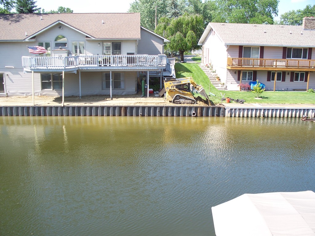 new black steel seawall on Grand River in Dimondale Michigan